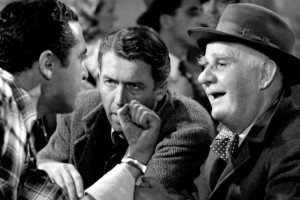 George Bailey and Clarence sitting at the bar
